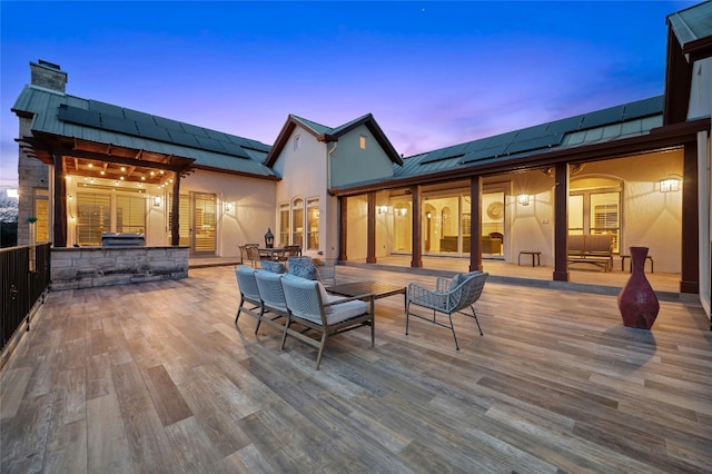 1386 Patterson Rd, Austin, TX 78733 - wooden deck with outdoor dining space and an outdoor kitchen