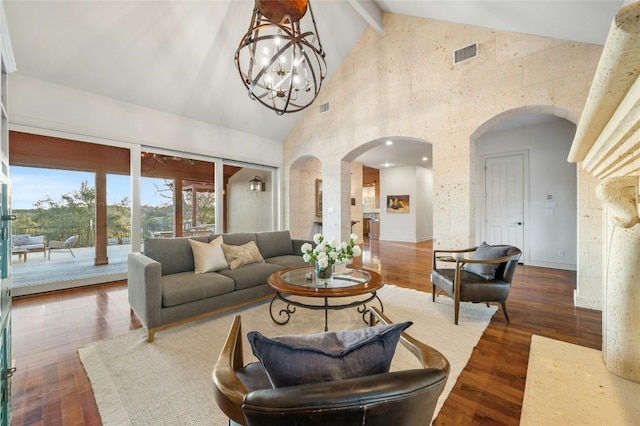 1386 Patterson Rd, Austin, TX 78733 - living area featuring arched walkways, high vaulted ceiling, dark wood-style flooring, a chandelier, and beam ceiling
