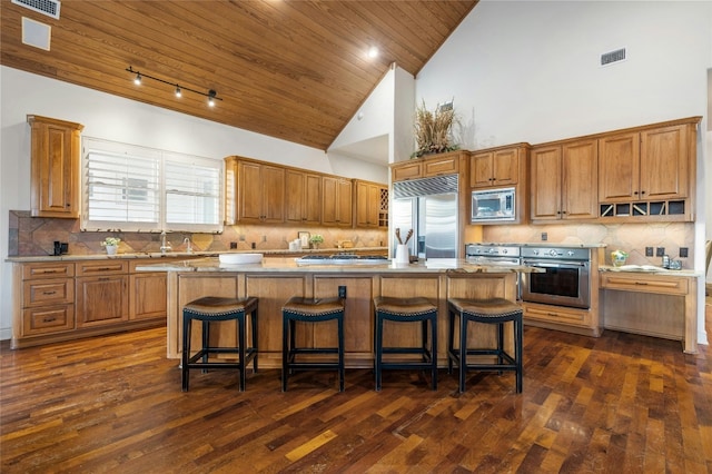 1386 Patterson Rd, Austin, TX 78733 - kitchen with built in appliances, a kitchen island, backsplash, wood ceiling, and high vaulted ceiling