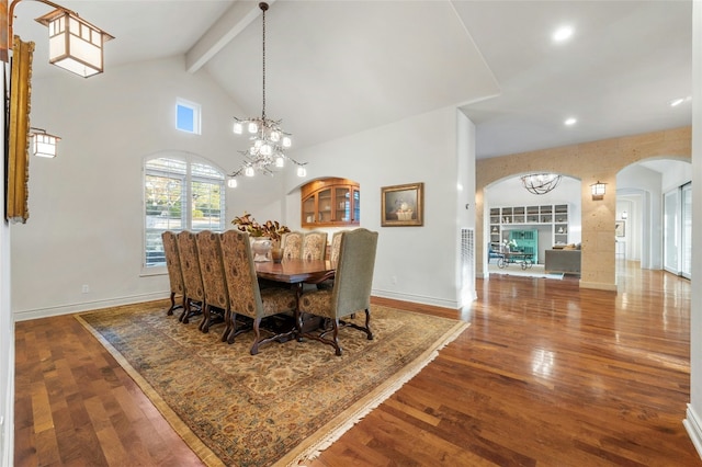 1386 Patterson Rd, Austin, TX 78733 - dining room featuring arched walkways, wood finished floors, high vaulted ceiling, beam ceiling, and a chandelier