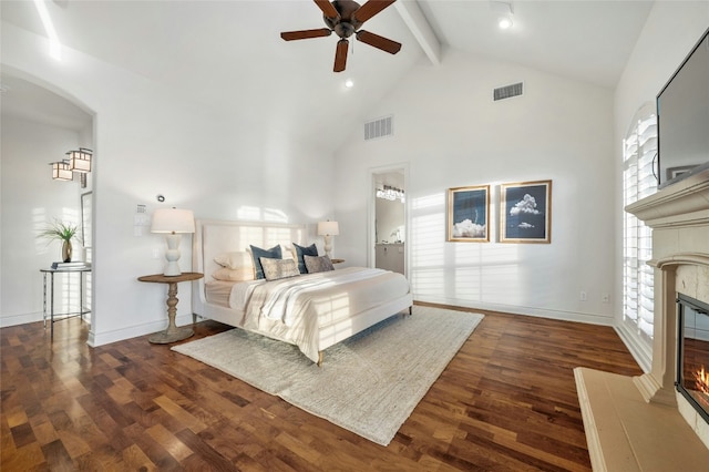 bedroom featuring a fireplace, dark wood finished floors, and visible vents