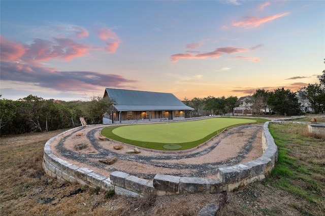 view of back of house at dusk