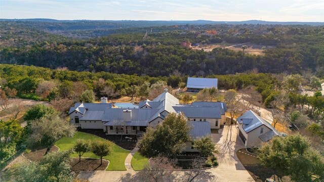 1386 Patterson Rd, Austin, TX 78733 - aerial view of property and surrounding area with a heavily wooded area