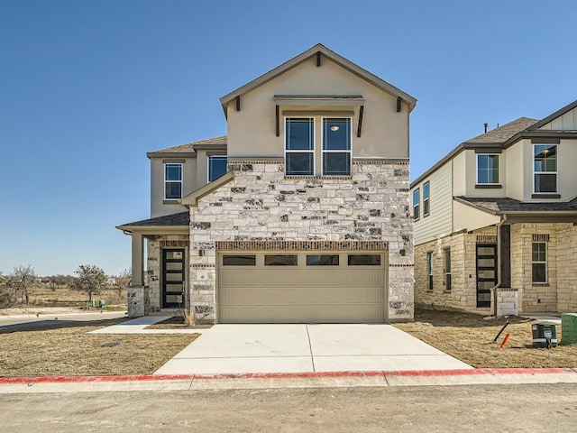 view of front facade with a garage, stone siding, concrete driveway, and stucco siding