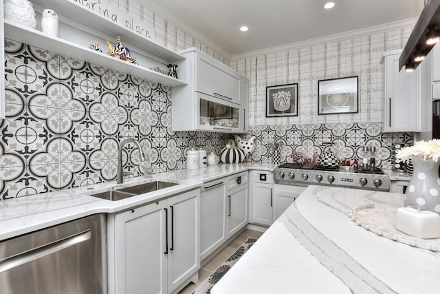 kitchen with open shelves, stainless steel dishwasher, ornamental molding, a sink, and light stone countertops