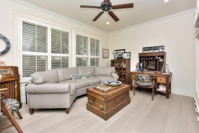 living room with ceiling fan, ornamental molding, light wood-style flooring, and baseboards