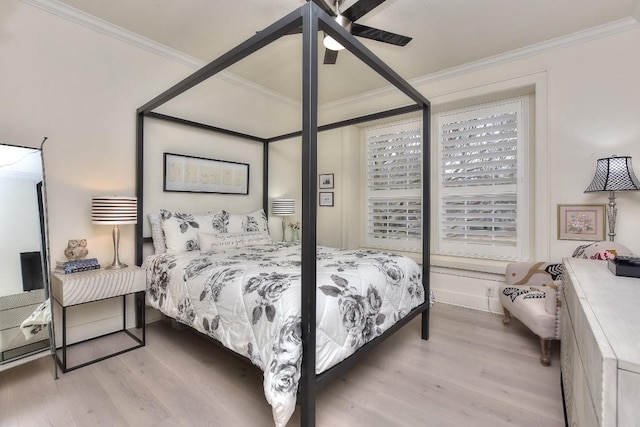 bedroom with ornamental molding and light wood finished floors