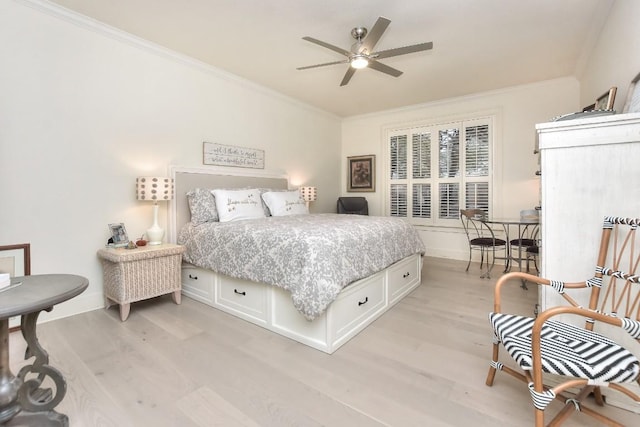 bedroom featuring ornamental molding, baseboards, and light wood finished floors