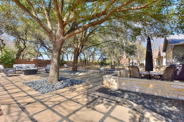 view of patio / terrace featuring fence and an outdoor living space