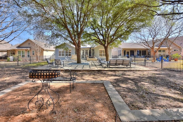 view of community with a patio area, fence, and outdoor lounge area