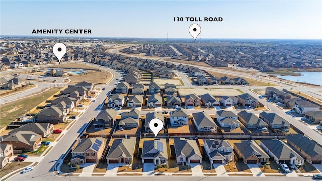 bird's eye view featuring a water view and a residential view