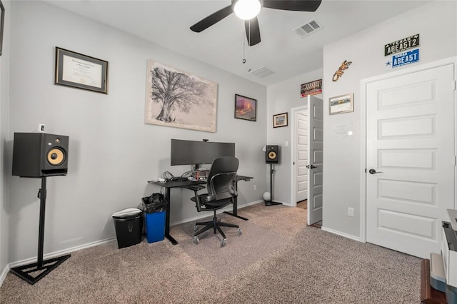 office with carpet floors, a ceiling fan, visible vents, and baseboards