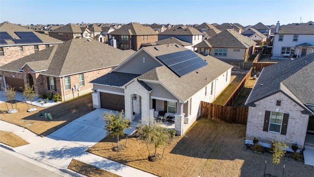 3721 Forino Dr, Round Rock, TX 78665 - view of front of property with a residential view, concrete driveway, a fenced backyard, roof with shingles, and a garage