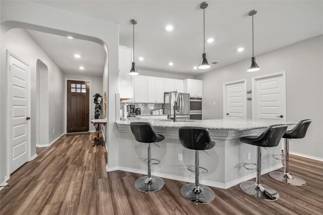 3721 Forino Dr, Round Rock, TX 78665 - kitchen featuring stainless steel fridge with ice dispenser, dark wood-type flooring, a peninsula, white cabinets, and recessed lighting