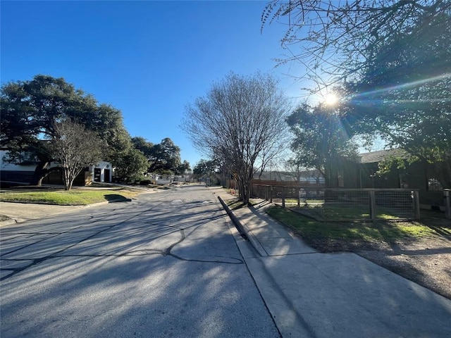 view of street with curbs