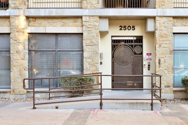 2505 San Gabriel St Unit 212, Austin, TX 78705 - property entrance featuring stone siding