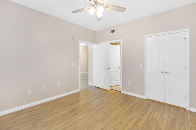 2505 San Gabriel St Unit 212, Austin, TX 78705 - unfurnished bedroom with light wood finished floors, baseboards, and ceiling fan