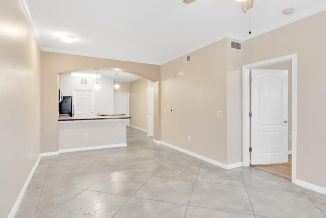 2505 San Gabriel St Unit 212, Austin, TX 78705 - unfurnished living room featuring arched walkways, ornamental molding, a ceiling fan, light tile patterned floors, and baseboards