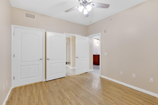 2505 San Gabriel St Unit 212, Austin, TX 78705 - unfurnished bedroom featuring baseboards, light wood finished floors, and ceiling fan