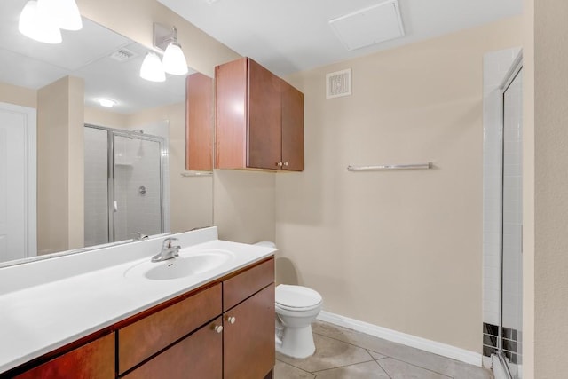 2505 San Gabriel St Unit 212, Austin, TX 78705 - bathroom featuring a shower stall, toilet, vanity, tile patterned floors, and baseboards