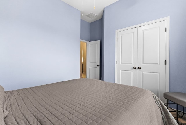 unfurnished bedroom featuring a closet, visible vents, and ceiling fan