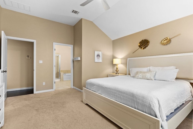 carpeted bedroom featuring baseboards, visible vents, vaulted ceiling, and ensuite bathroom