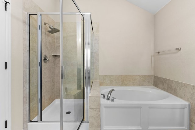 full bath featuring a shower stall and a bath