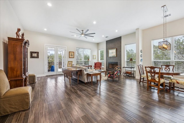 living area with french doors, recessed lighting, visible vents, a fireplace, and dark wood-style floors