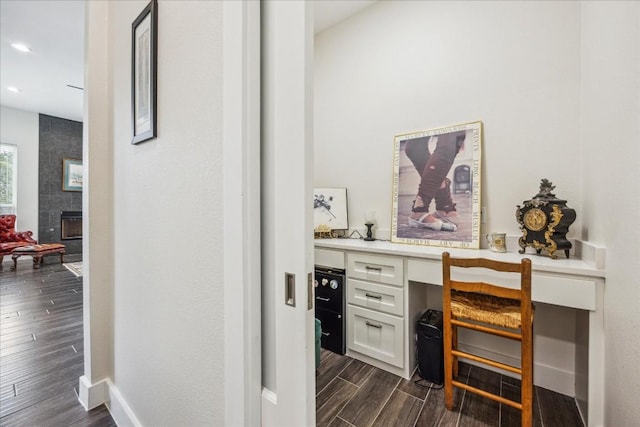 interior space featuring baseboards, dark wood finished floors, and recessed lighting