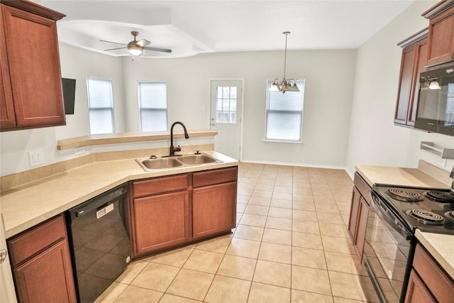 kitchen with a peninsula, light countertops, black appliances, a sink, and ceiling fan with notable chandelier