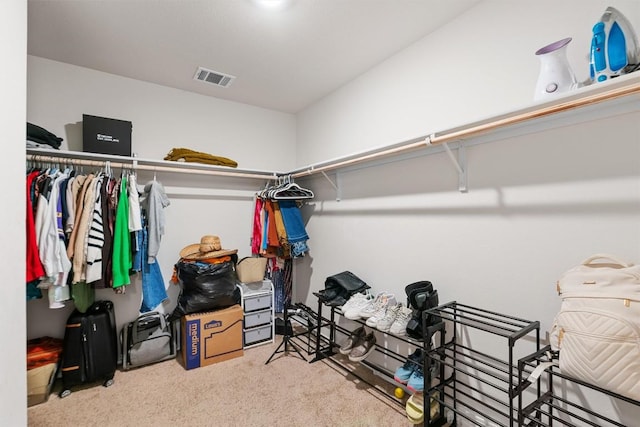 spacious closet with light carpet and visible vents