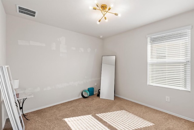 interior space featuring light carpet, baseboards, and visible vents