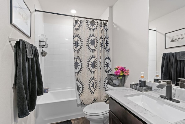 bathroom with toilet, shower / bath combination with curtain, and vanity