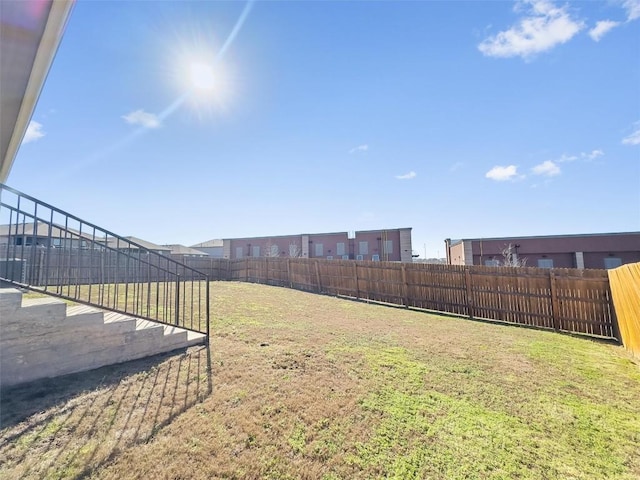 view of yard featuring a fenced backyard