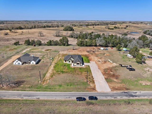 birds eye view of property featuring a rural view