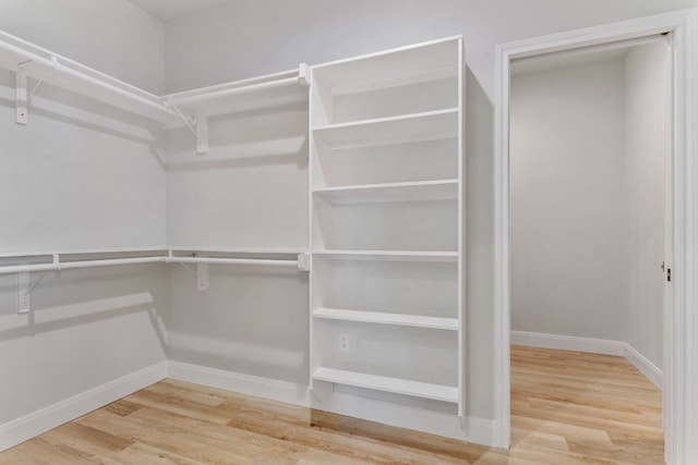 spacious closet with wood finished floors