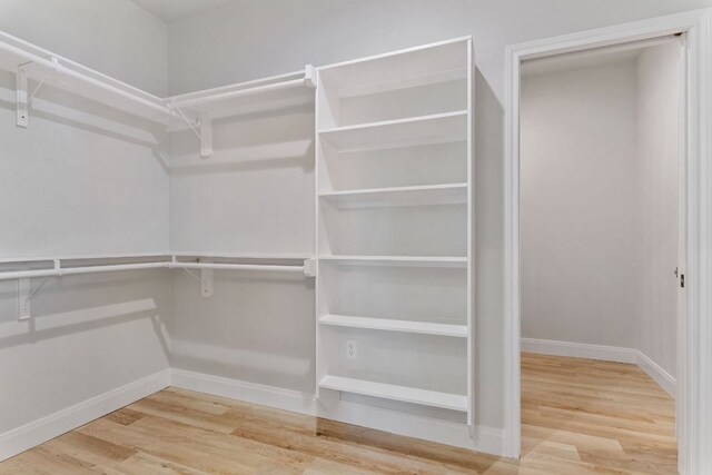 1730 County Road 217, Giddings, TX 78942 - walk in closet with wood finished floors