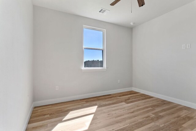 1730 County Road 217, Giddings, TX 78942 - unfurnished room featuring a ceiling fan and light wood-style flooring