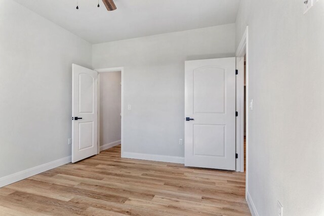 1730 County Road 217, Giddings, TX 78942 - unfurnished bedroom featuring light wood-type flooring and a ceiling fan