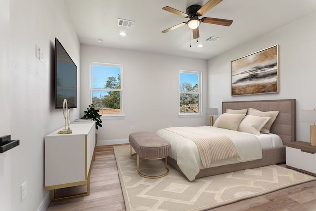 bedroom featuring recessed lighting, baseboards, visible vents, and light wood finished floors