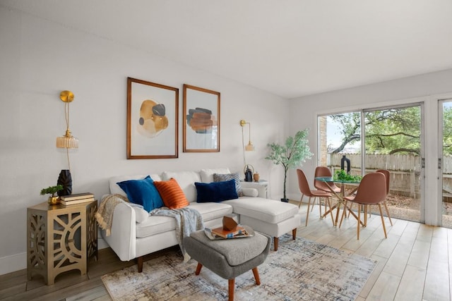 620 S 1st St Unit 104, Austin, TX 78704 - living room featuring light wood finished floors and baseboards
