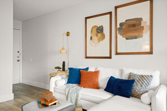 living room with light wood-style flooring and baseboards