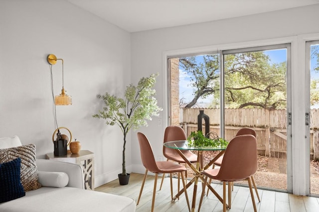 interior space featuring light wood-style floors and baseboards