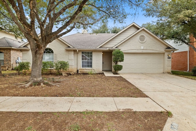 ranch-style house with a shingled roof, concrete driveway, brick siding, and an attached garage