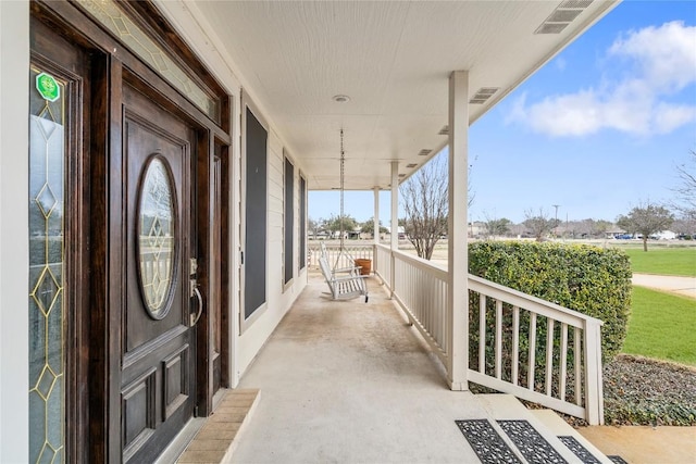 balcony with covered porch and visible vents