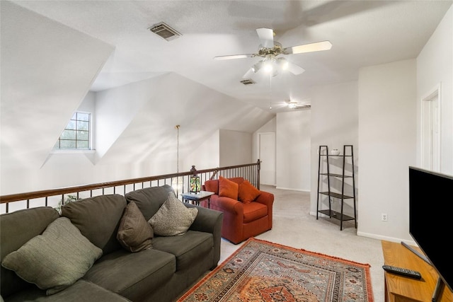 living area with light carpet, ceiling fan, visible vents, and baseboards