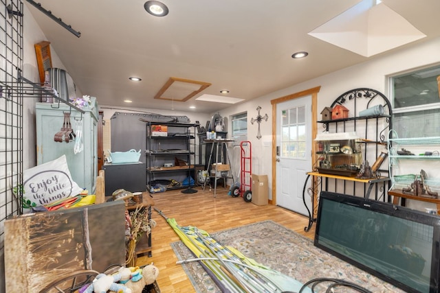 interior space with wood finished floors and recessed lighting