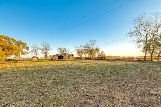 view of yard with a rural view