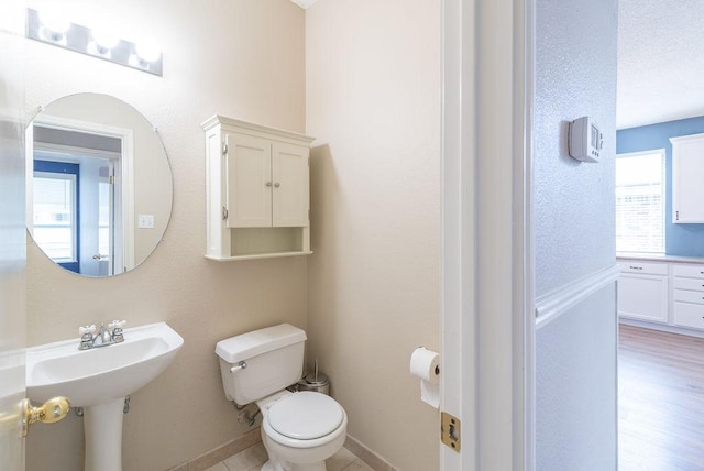 8507 Chat Ln, Round Rock, TX 78681 - bathroom featuring toilet and baseboards