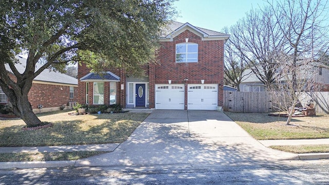 traditional-style home with an attached garage, brick siding, fence, concrete driveway, and a front lawn